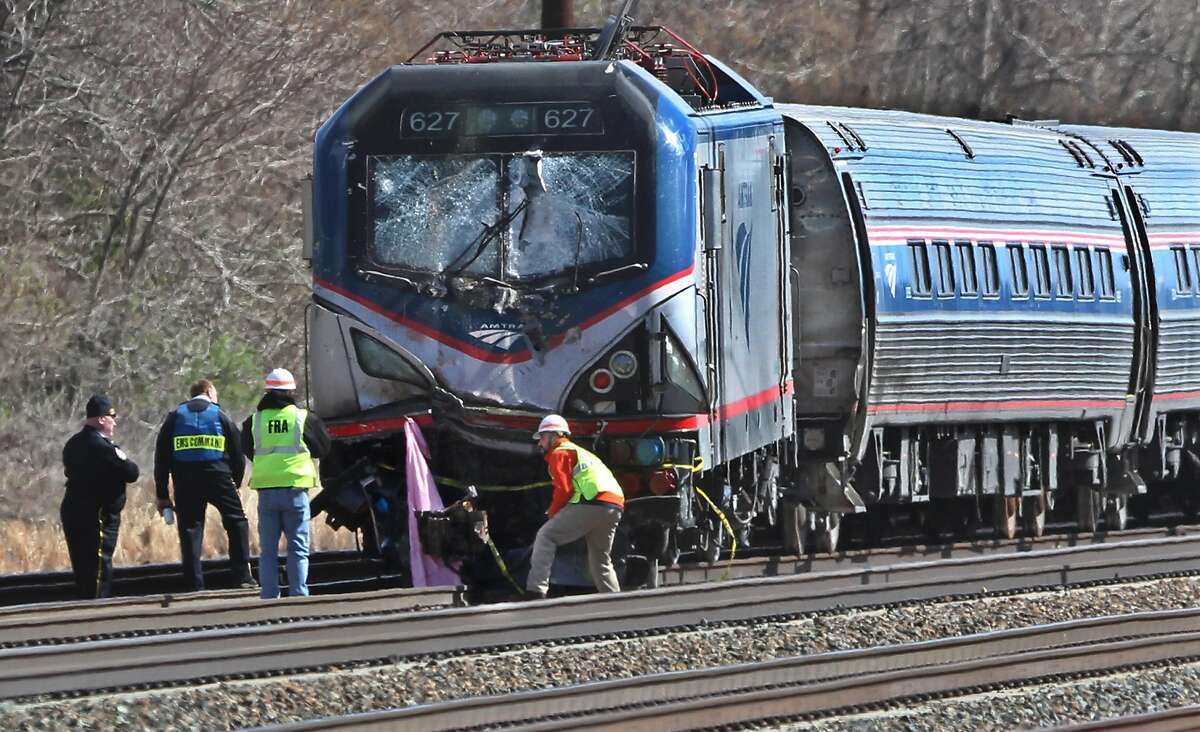 Amtrak investigators inspect the deadly train crash in Chester, Pa., Sunday, April 3 2016. The Amtrak train struck a piece of construction equipment just south of Philadelphia causing a derailment. (Michael Bryant/The Philadelphia Inquirer via AP) PHIX OUT; TV OUT; MAGS OUT; NEWARK OUT; MANDATORY CREDIT