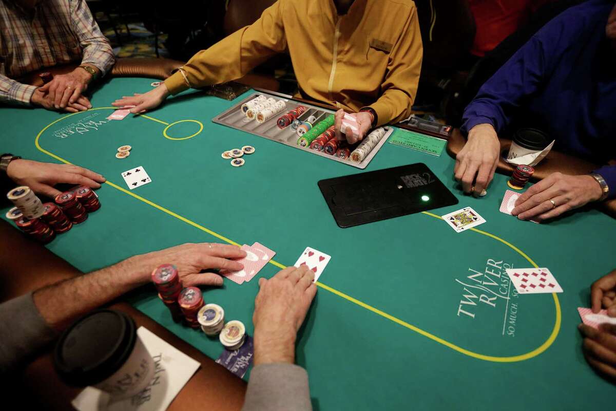 A game of poker is dealt to patrons at Twin River Casino, in Lincoln, R.I., on Feb. 3, 2016. Casinos far from Las Vegas are experimenting with different ways to draw millennials.