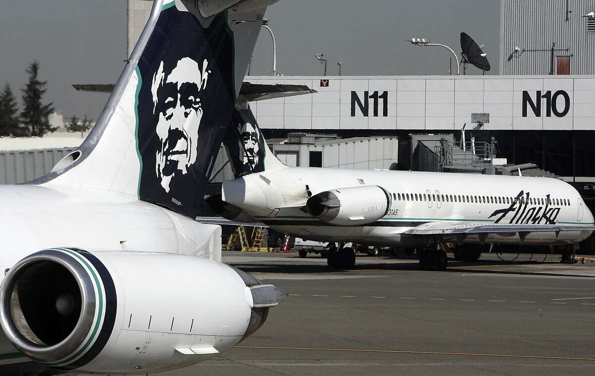 FILE - This file photo taken on September 25, 2006 shows Alaska Airlines planes at Seattle-Tacoma International Airport.