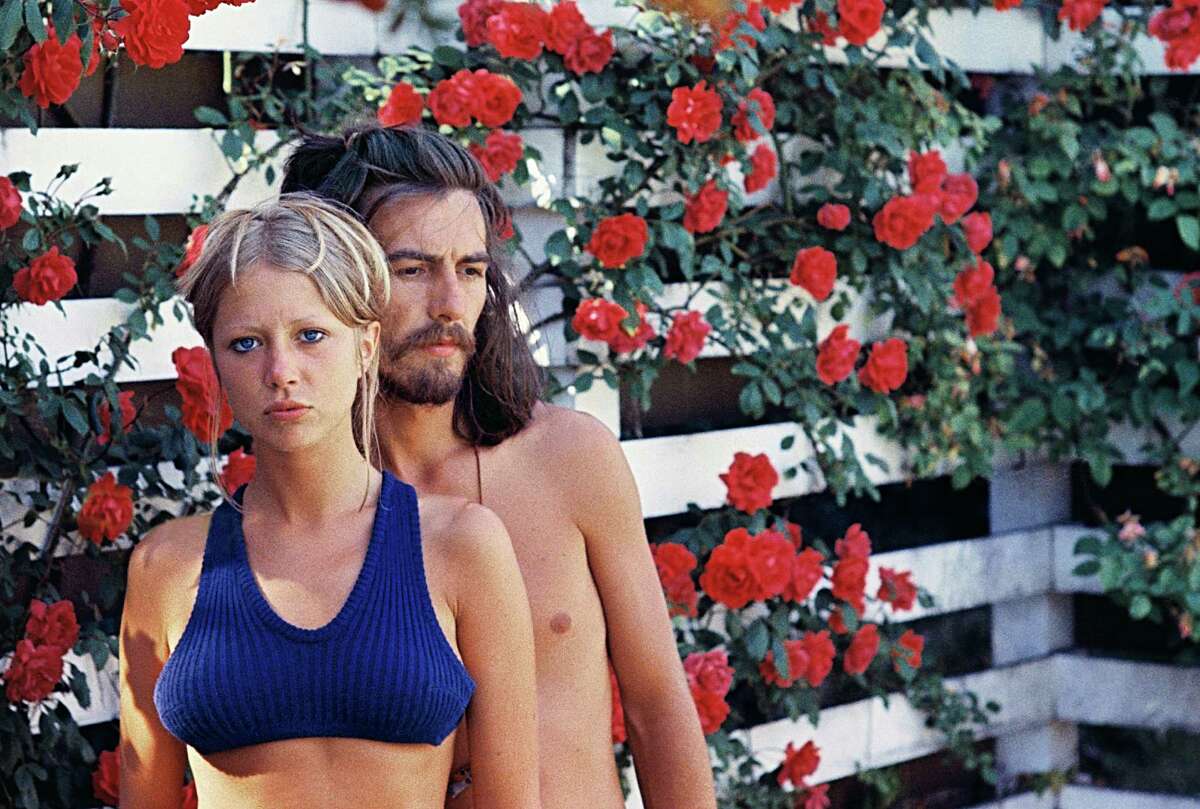 Pattie Boyd took this photo of her and George Harrison in a rose garden in Surrey, England, in 1968. Photography by Pattie Boyd.