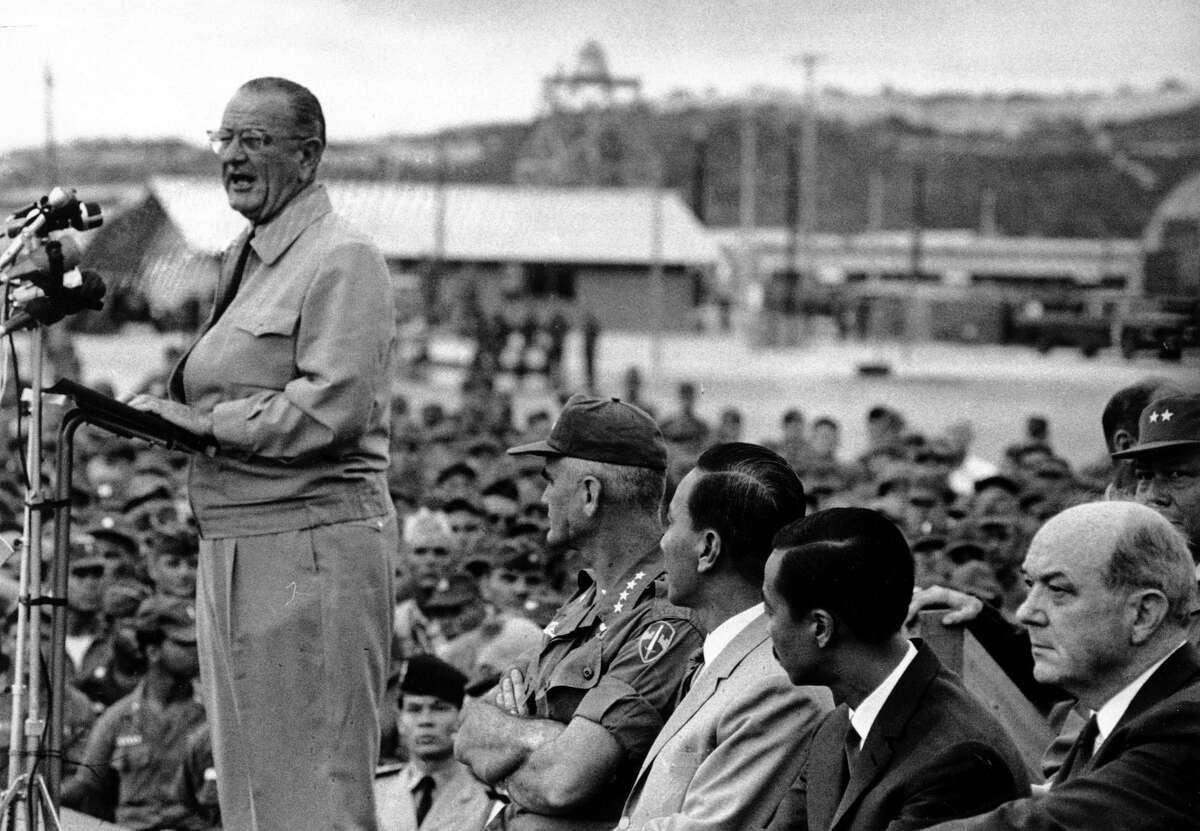President Johnson talks to American Troops at Cam Ranh Bay, during the Vietnam war in this Oct. 26, 1966, file photo. Behind Johnson, left to right, are Gen. William Westmoreland, Commander of the U.S. troops in Vietnam, Gen. Nguyen Van Thieu, Vietnamese Chief of State, Premier Nguyen Cao Ky of Vietnam, and U.S. Secretary of State Dean Rusk.