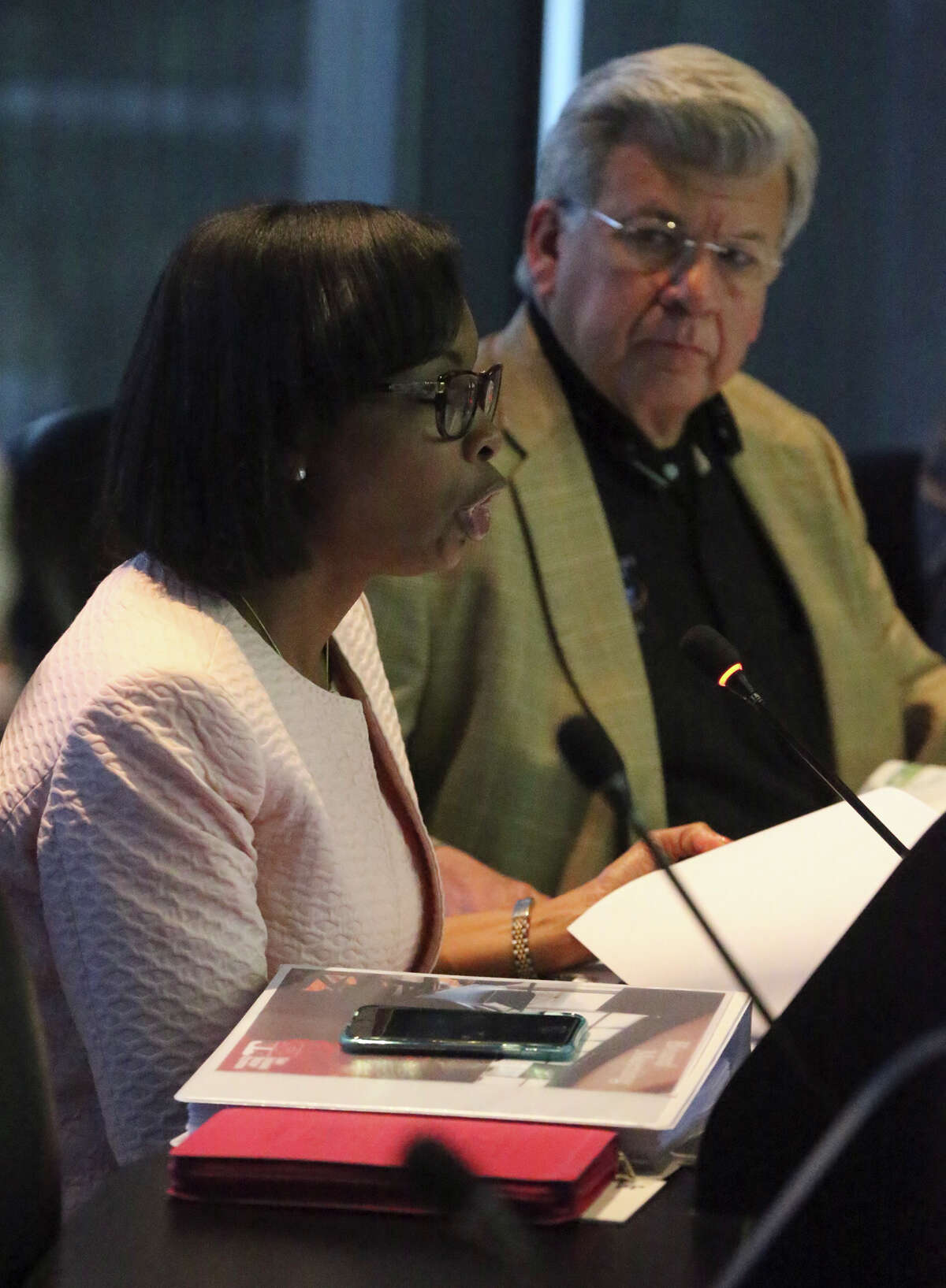 San Antonio Mayor Ivy Taylor (foreground) speaks Tuesday at the San Antonio Water Board of Trustees meeting regarding Garney Construction's plan to buy 80 percent of Abengoa's stake in the Vista Ridge pipeline. In the background is Berto Guerra Jr., chairman of the SAWS Board of Trustees.