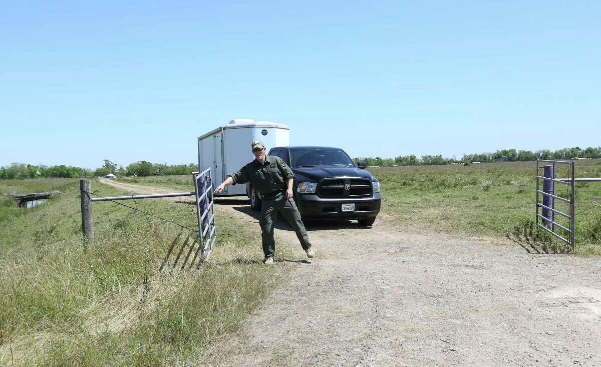 Crews leave the Brazoria County field Tuesday that may hold the answer to Kelli Cox's disappearance.﻿