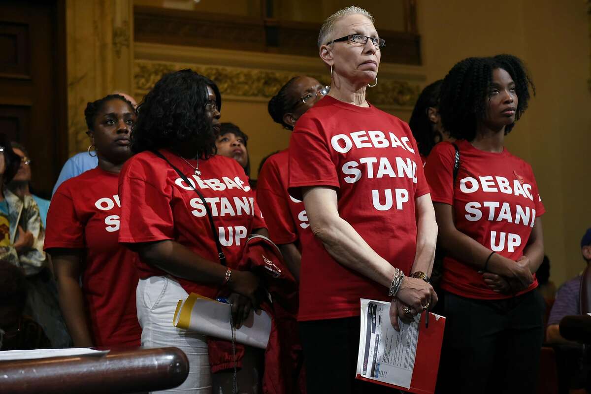 Lynn Haines Dodd, center, waits with other members of the Oakland East Bay Alumnae Chapter of Delta Sigma Theta to speak out against rental prices during the public comment portion of an Oakland City Council meeting held to decide whether to impose a 90-day moratorium on no-cause evictions and rent increases for Oakland residents, at City Hall in Oakland, CA, Tuesday, April 5, 2016.