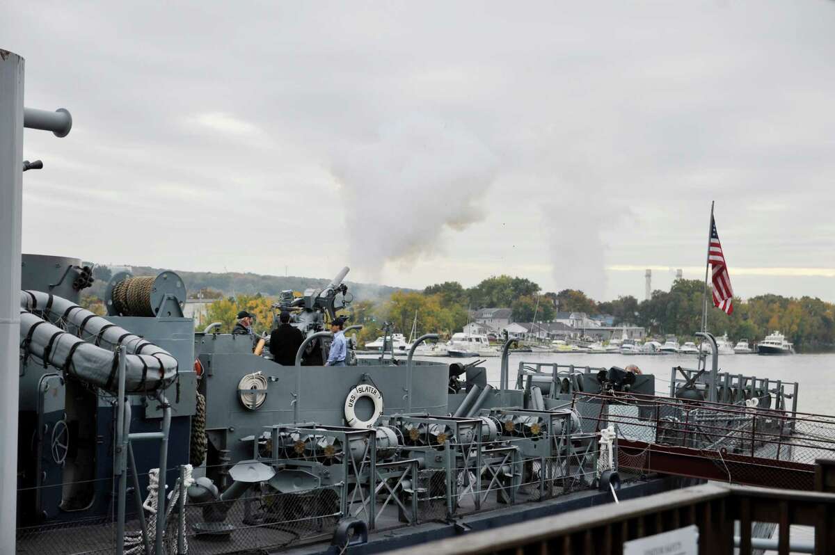 A three-inch gun is fired to honor all USS Slater volunteers at the USS Slater during a 239th Navy Birthday Celebration on Monday, Oct. 13, 2014, in Albany, N.Y. (Paul Buckowski / Times Union)