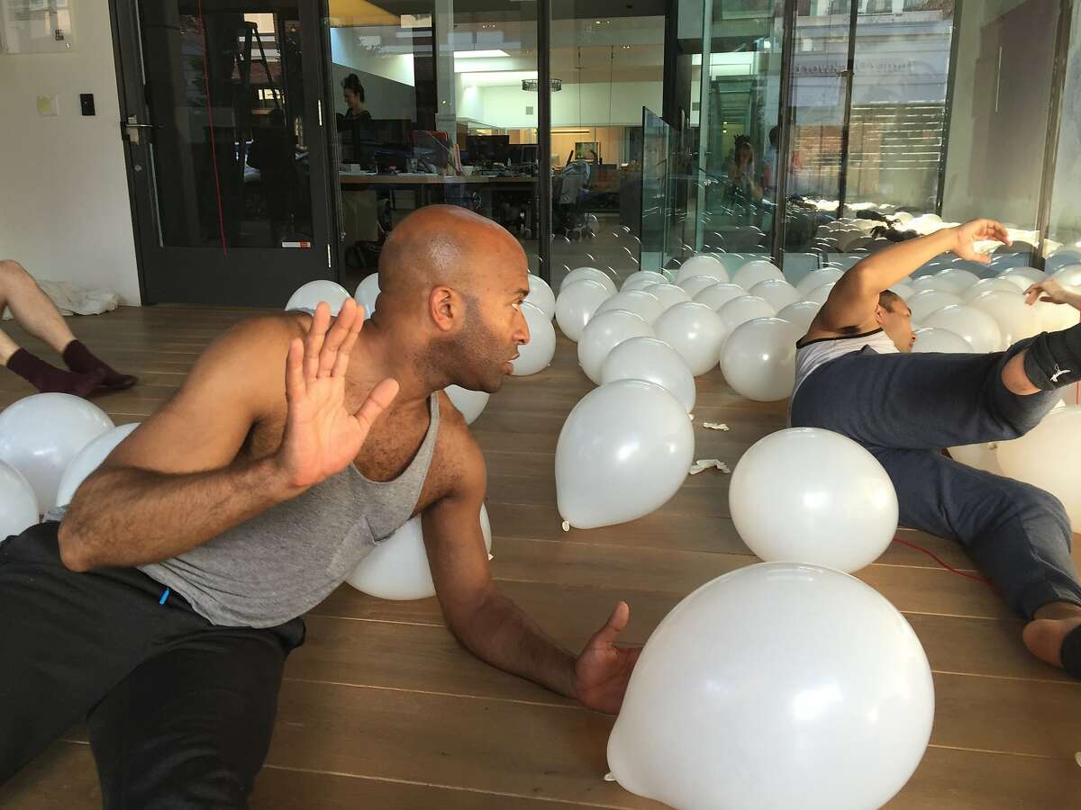 Corey Brady and Kelly Del Rosario work out a dance phrase in a field of balloons. RAWdance�s site-specific rehearsals continue at 836M Gallery through June 3. Photo by Claudia Bauer