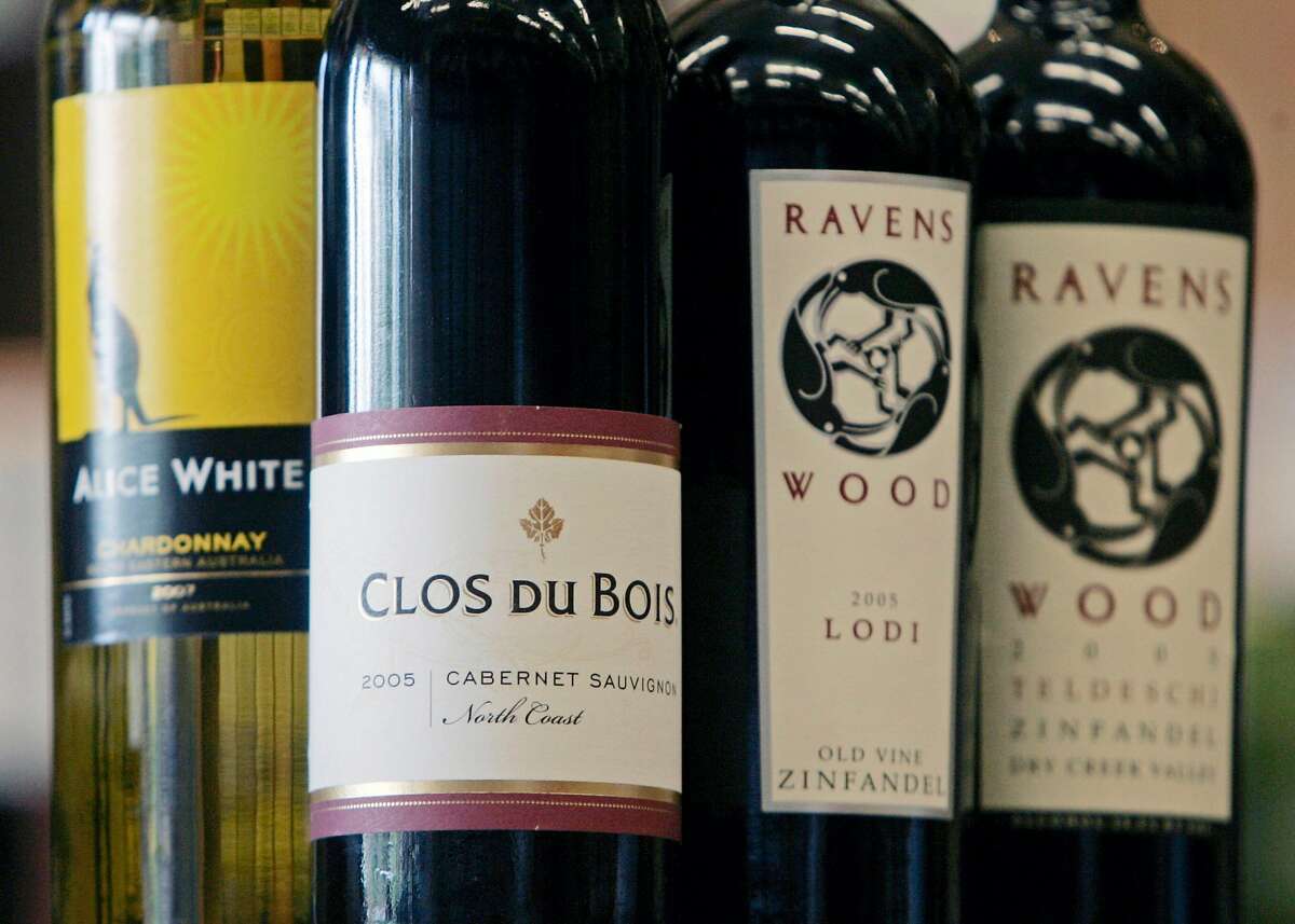 FILE - In this July 1, 2008 file photo, bottles of Clos Du Bois, Ravens Wood and Alice White, wines in the Constellation Brands, are seen at Empire Wine and Liquor Outlet in Colonie, N.Y. Wine and spirits maker Constellation Brands says it moved to a fiscal second-quarter profit on the absence of an impairment charge and lower restructuring costs, beating analysts' estimates.(AP Photo/Mike Groll, file)