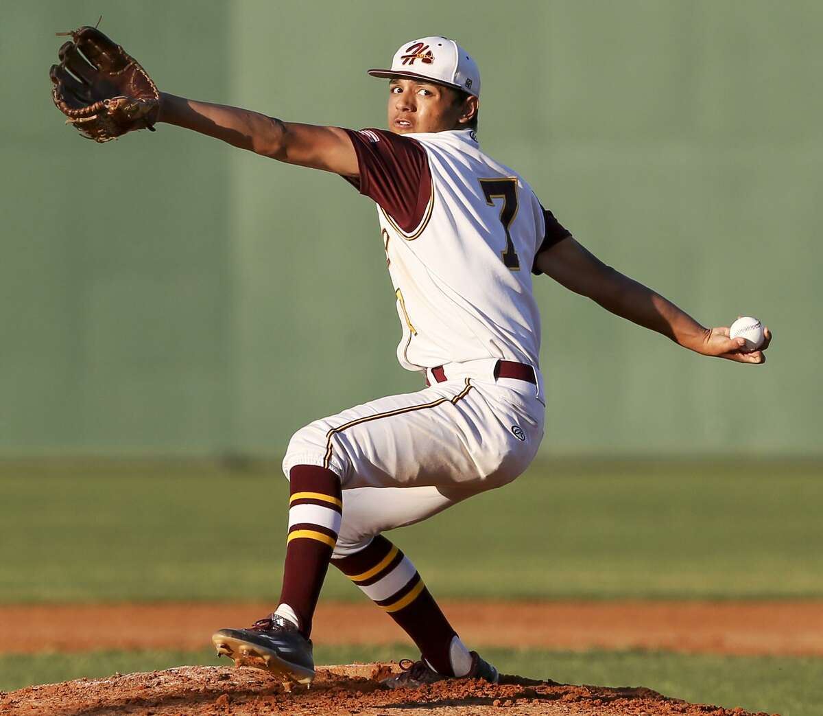 Harlandale’s Nathan Reyes winds up during the first inning of a 28-5A game against McCollum at the Tejada Sports Complex on March 31 2016.