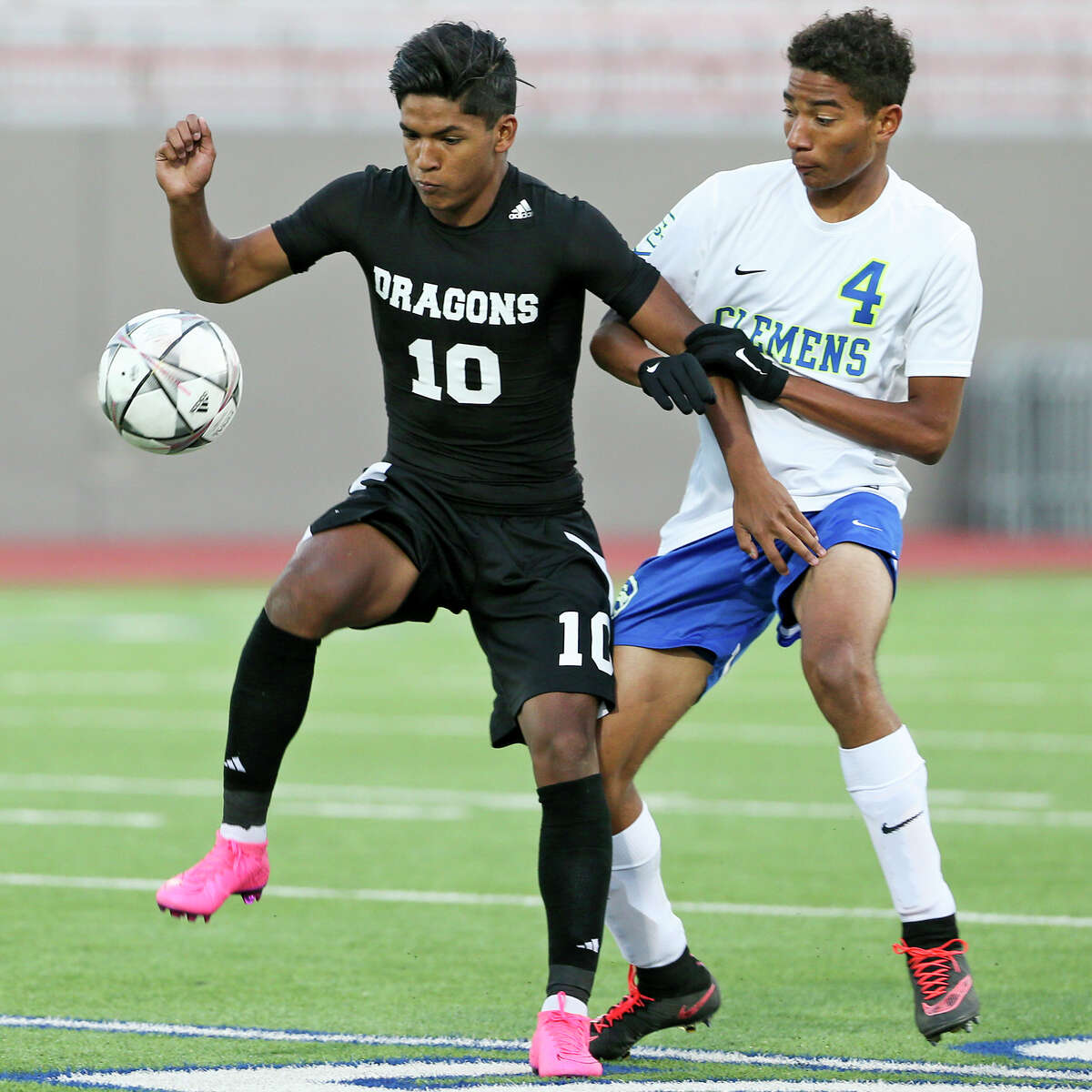 Southwest's J.P. Ortiz (left) controls the ball against Clemens' Coleton Stewart during the first half of their second round playoff game at Alamo Stadium on Friday, April 1, 2016. Clemens beat Southwest 1-0. MARVIN PFEIFFER/ mpfeiffer@express-news.net