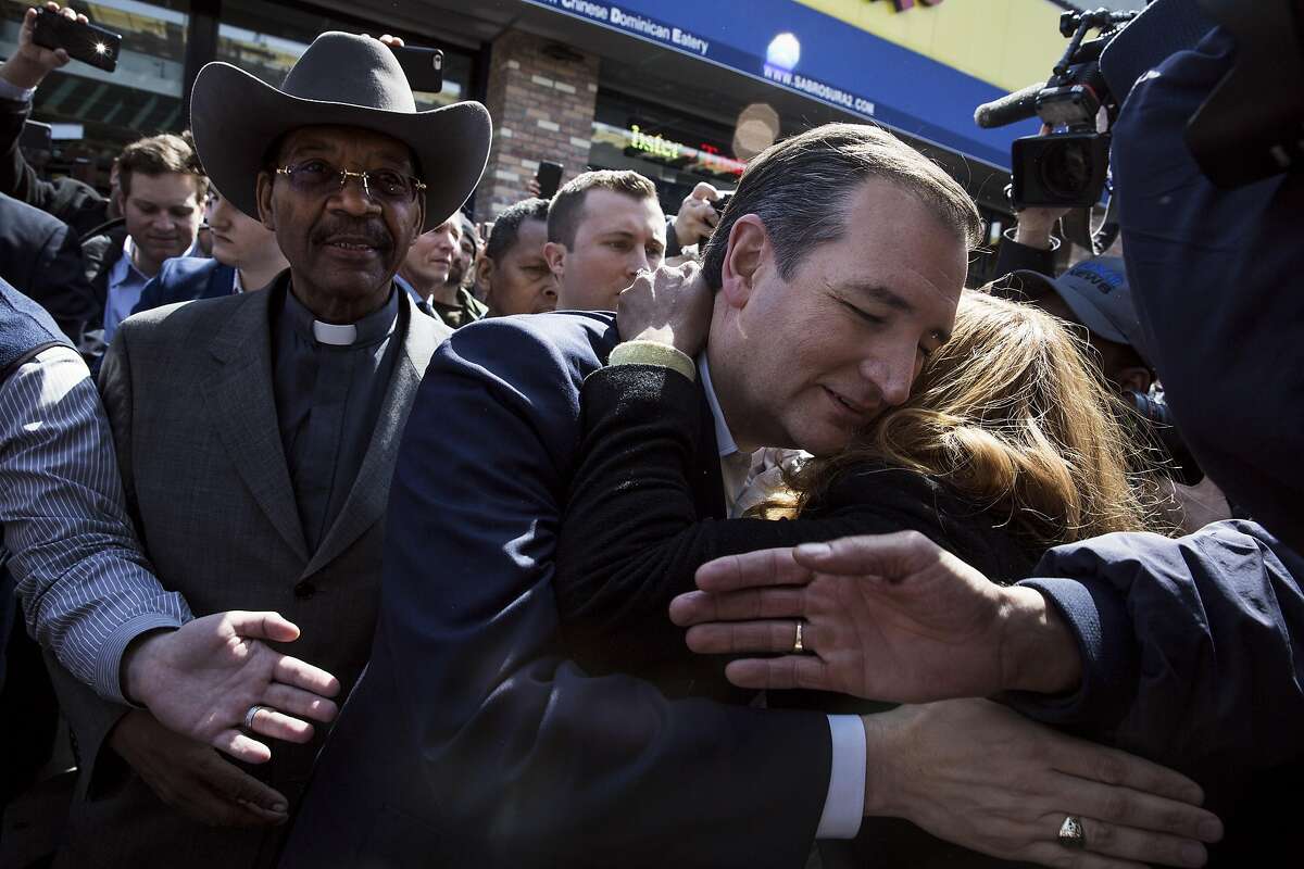Sen. Ted Cruz of Texas, a Republican presidential hopeful, hugs a supporters outside the Sabrosura 2 restaurant with State Sen. Ruben Diaz Sr. in the Bronx borough of New York, April 6, 2016. The state holds its presidential primaries on April 19. (Todd Heisler/The New York Times)