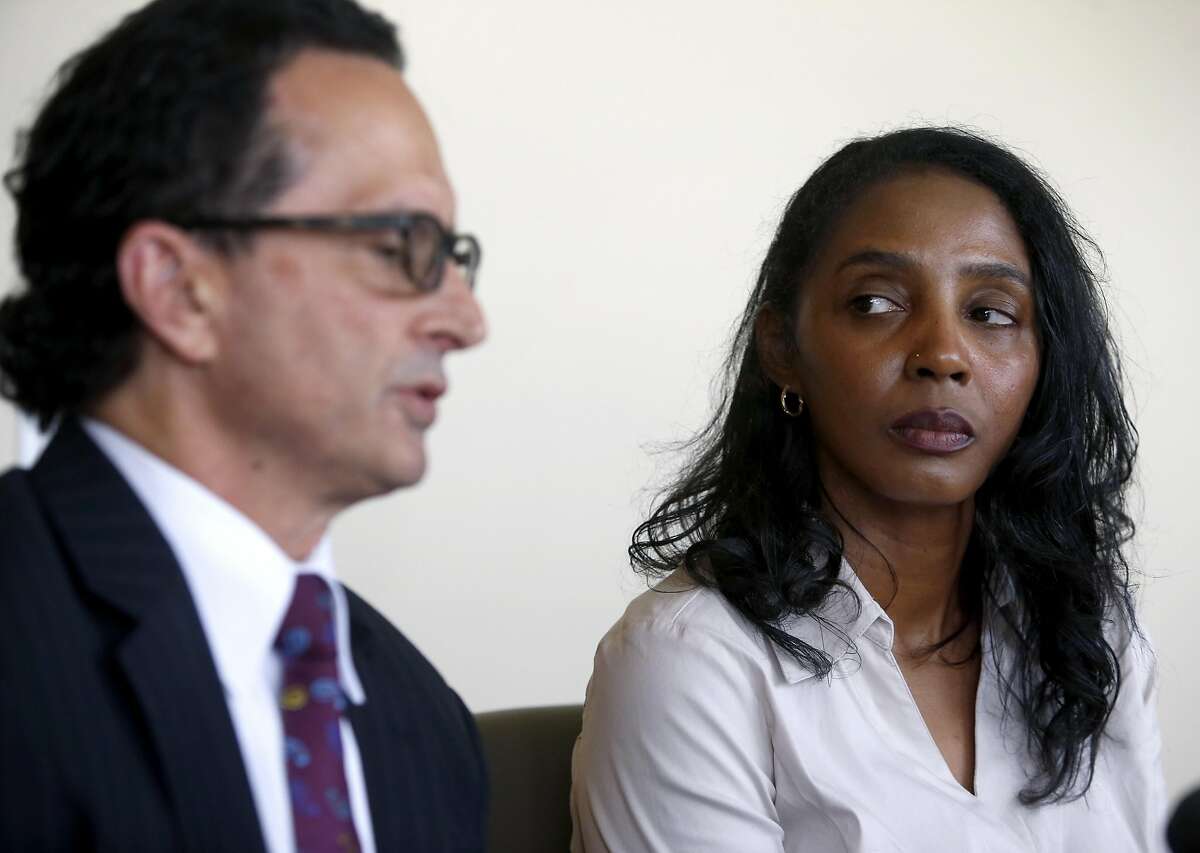 Tyann Sorrell, executive assistant to former UC Berkeley Law School Dean Sujit Choudhry, comments on a sexual harassment lawsuit filed against the university and Choudry, during a news conference at the office of her attorney John Winer (left) in Oakland, Calif. on Wednesday, April 6, 2016.