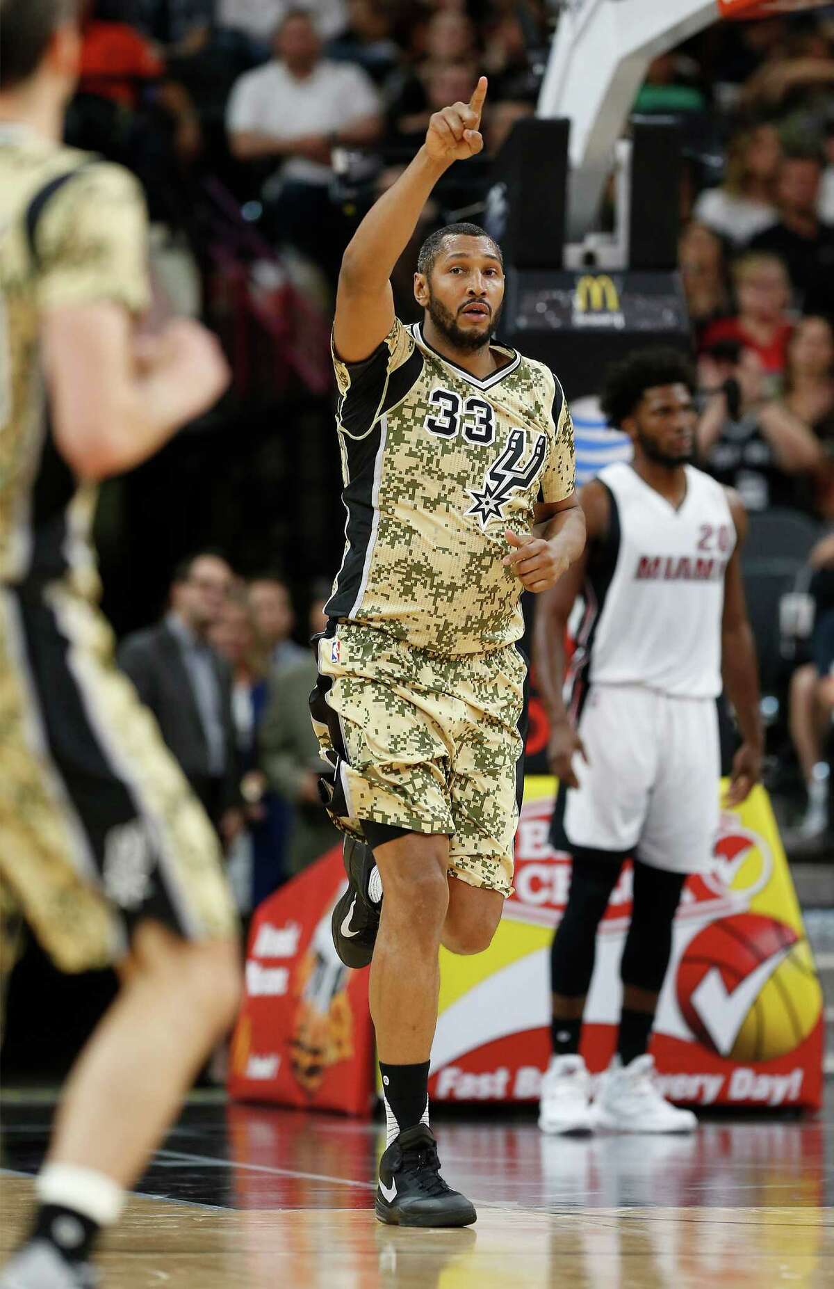 Spurs’ Boris Diaw acknowledges an assist against the Miami Heat at the AT&T Center on March 23, 2016.