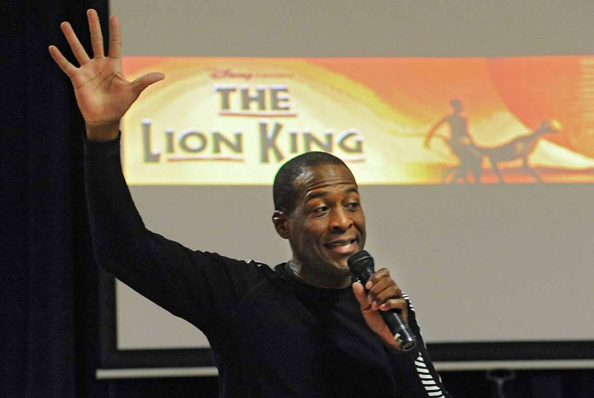 Russell Joel Brown, a bass and MufasaOs understudy in Disney's "The Lion King" North American Tour, talks to children at the Jewish Community Center of Schenectady on Wednesday, April 6, 2016 in Niskayuna, N.Y. BrownOs outreach program "Project: Inspire", uses elements from Disney's "The Lion King" stage production to teach choreography from the show to the students and to encourage them to strive for excellence, to find their own voice and their own career path. (Lori Van Buren / Times Union)