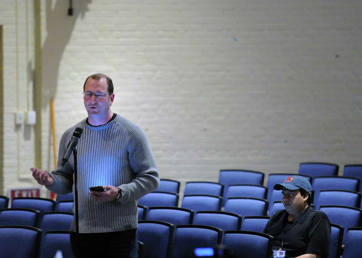 Ken Pond, the father of a Greenwich public school student, speaks during the school district public forum on school start times at Central Middle School in Greenwich, Conn., Wednesday night, April 6, 2016.