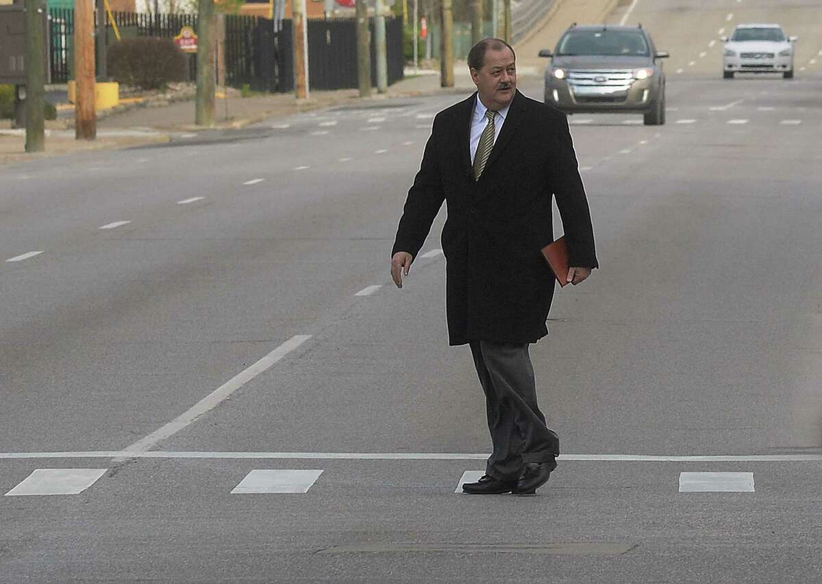 Former Massey Energy CEO Don Blankenship makes his way across Virginia Street in Charleston, W.V., before entering the Robert C. Byrd Federal Courthouse for his sentencing, Wednesday, April 6, 2016. Blankenship faces up to one year in prison and maximum fine of $250,000 for a conviction connected to the deadliest U.S. mine explosion in four decades. Prosecutors also contend he should be held liable for $28 million in restitution to a coal company related to the case. (F. Brian Ferguson/The Gazette-Mail via AP)