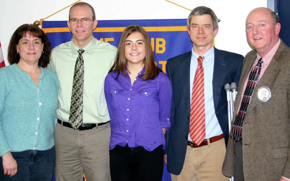 Spectrum/The New Milford Rotary Club recently presented New Milford High School senior Mackenzie Morehouse with a December 2015 Student of the Month award. Mackenzie is a National Merit Scholar and is a member of the French and National honor societies, has made highest honors since seventh grade, and plays flute in the concert band, wind ensemble and orchestra. She does peer tutoring and volunteers at New Milford Hospital, coordinates local food drives and served as chairperson for the Diaper Drive. She plans to pursue a degree in neuroscience and a career as a research or clinical psychologist. Above, Mackenzie, center, is congratulated by, from left to right, her mother and father, Teresa and Andrew Morehouse, NMHS social studies teacher Kevin Hudson and Rotarian Rob Belden.