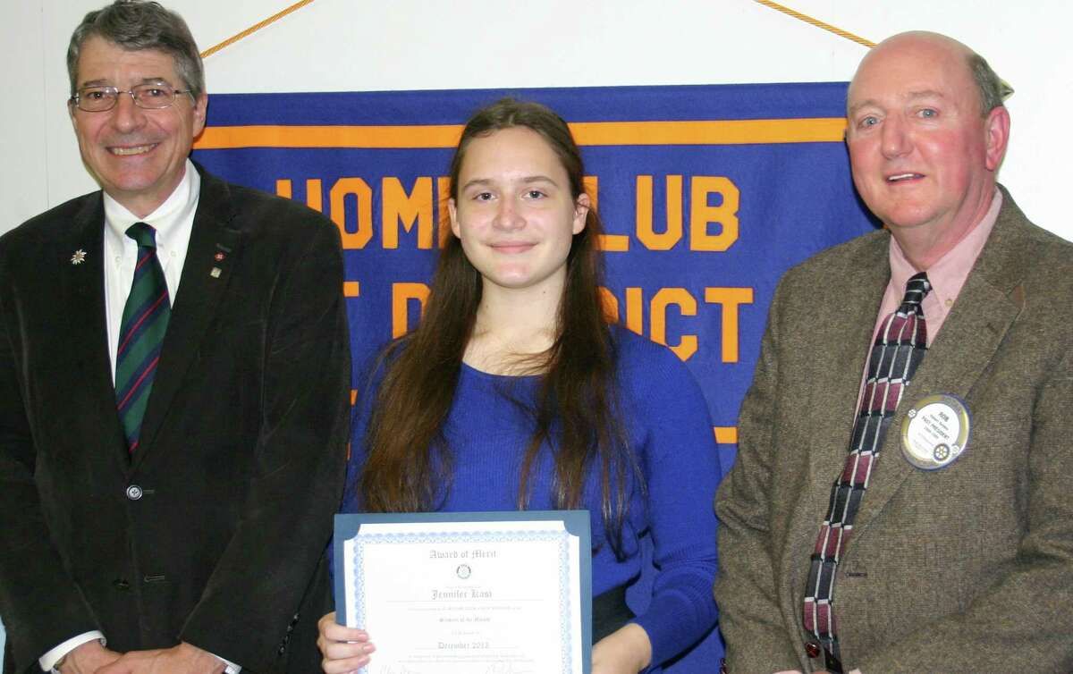 Spectrum/The New Milford Rotary Club recently presented New Milford High School junior Jennifer Kast with a December 2015 Student of the Month award. Jennifer has received Awards of Excellence in AP biology, world history, French and German language studies and is a member of the National, French and German honor societies. She enjoys dance, art and architecture and volunteers as an entertainer at local nursing homes. She plans to major in biology and Russian and pursue a career with the FBI as a forensic scientist and language analyst. Above, Jennifer is congratulated by NMHS world language teacher Michael Crotta, left, and Rotarian Rob Belden.