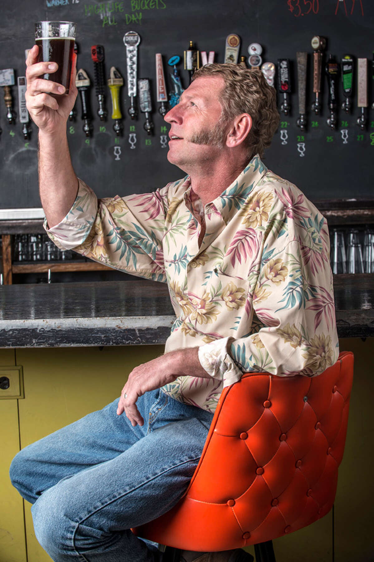 "Rob, along with his wife Sara, are the brains behind Cottonwood pub and LaGrange restaurant. He's had his signature sideburns since high school. Now that's commitment." -- Ray Redding  Rob Cromie shot by Ray Redding for his exhibit, "Houston Hair-raisers."