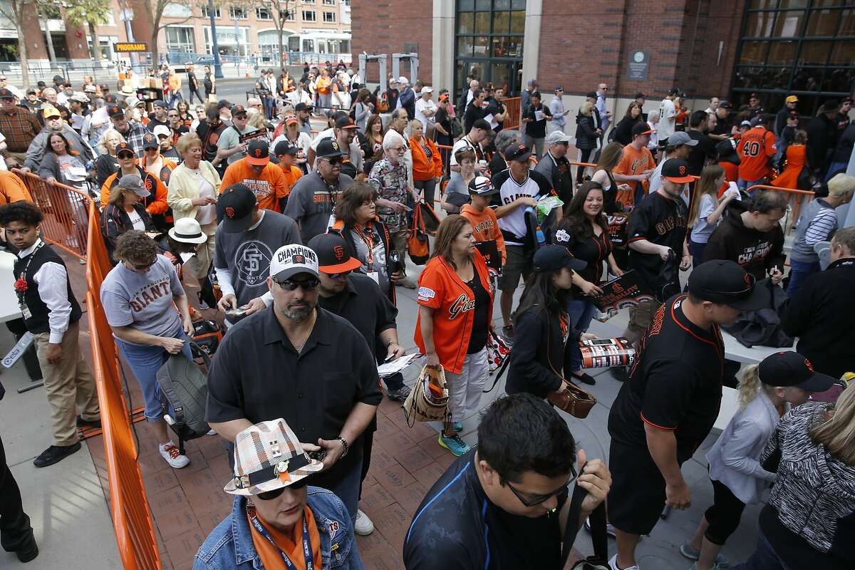 Fans stream into the ballpark as the San Francisco Giants get set to take on the Los Angeles Dodgers during opening day of the 2016 MLB season, at AT&T Park in San Francisco, California on Thurs. April 7, 2016.