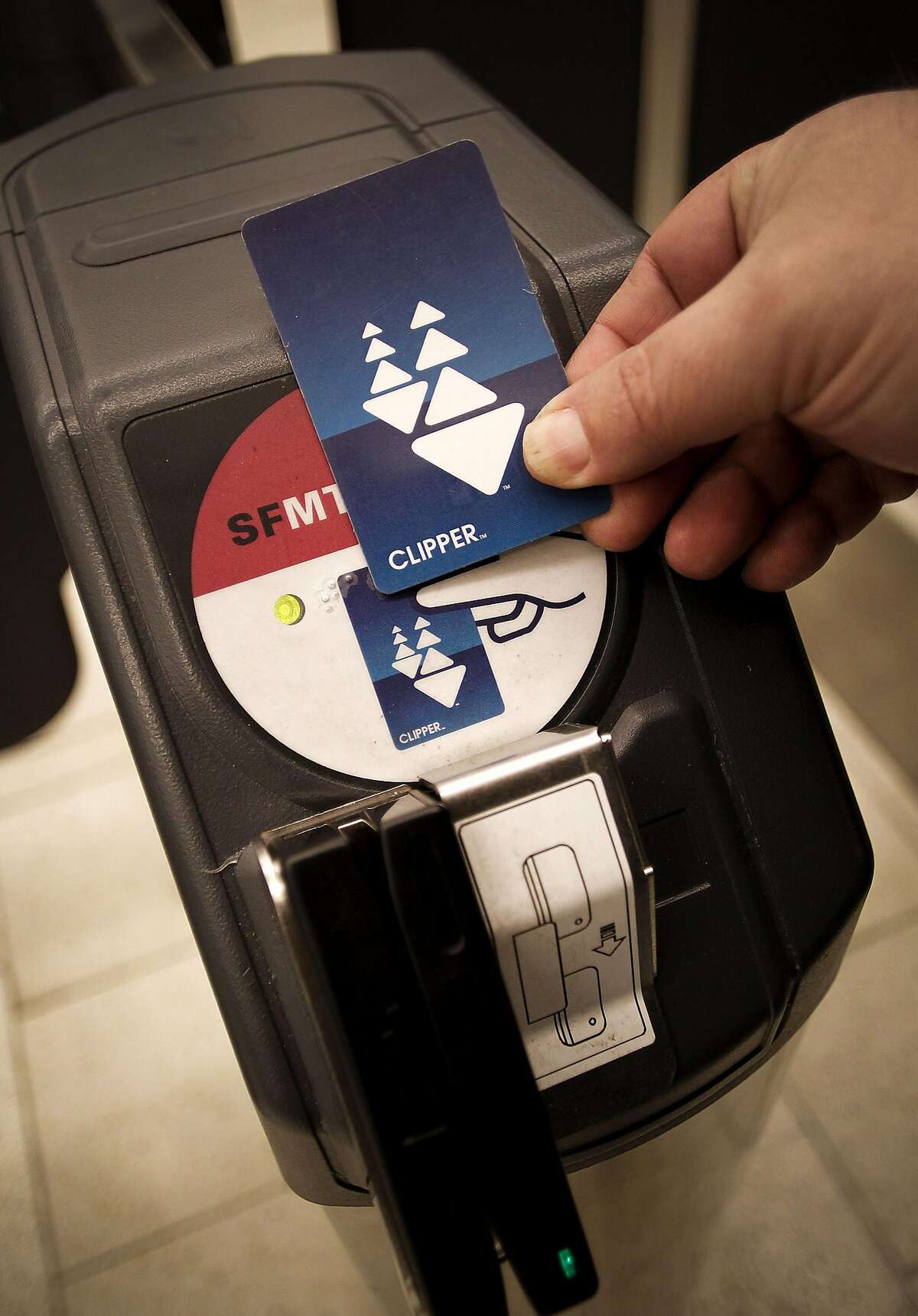 A passenger swipes the Clipper Card to access the MUNI station at the Powell Street BART station in San Francisco, Ca., on Thursday March 17, 2011.