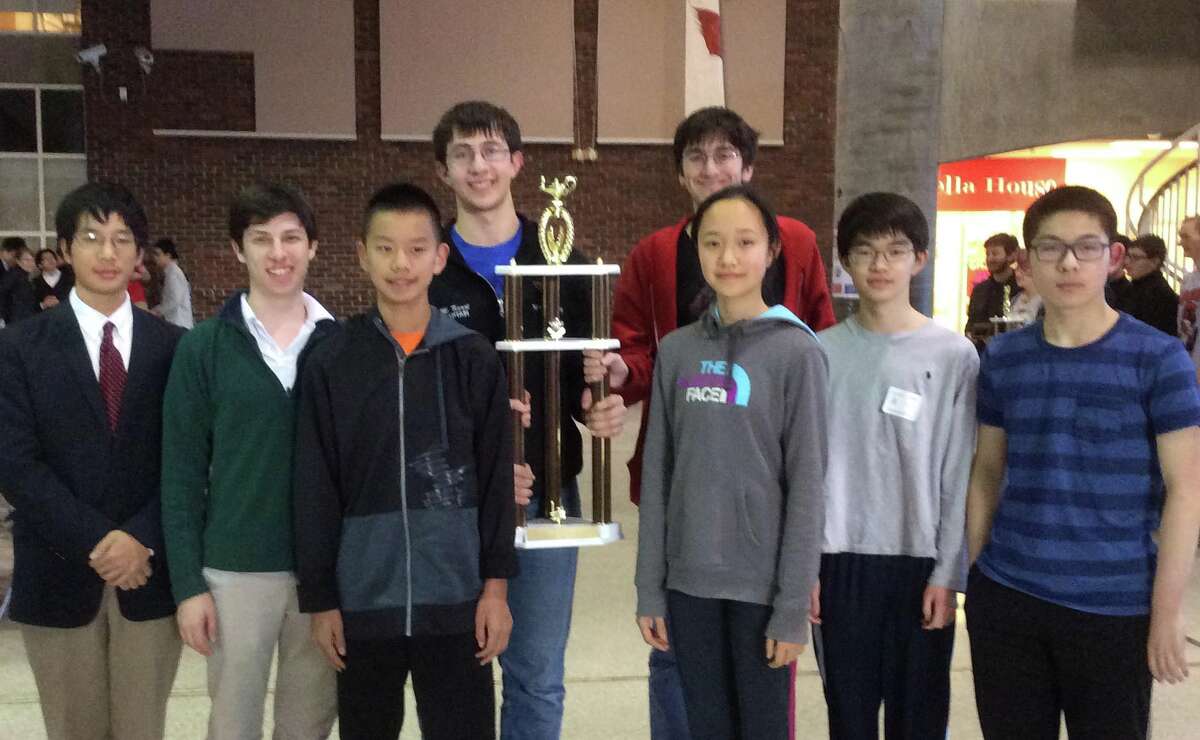 Greenwich High School varsity math team members celebrate their state championship victory Wednesday, April 6, 2016 in the student center at Greenwich High School. From left, are: William Yin, Robby Blank, Derrick Xiong, Michael Kural, Bennett Brain, Jovita Li, Steven Ma and Jason Shi