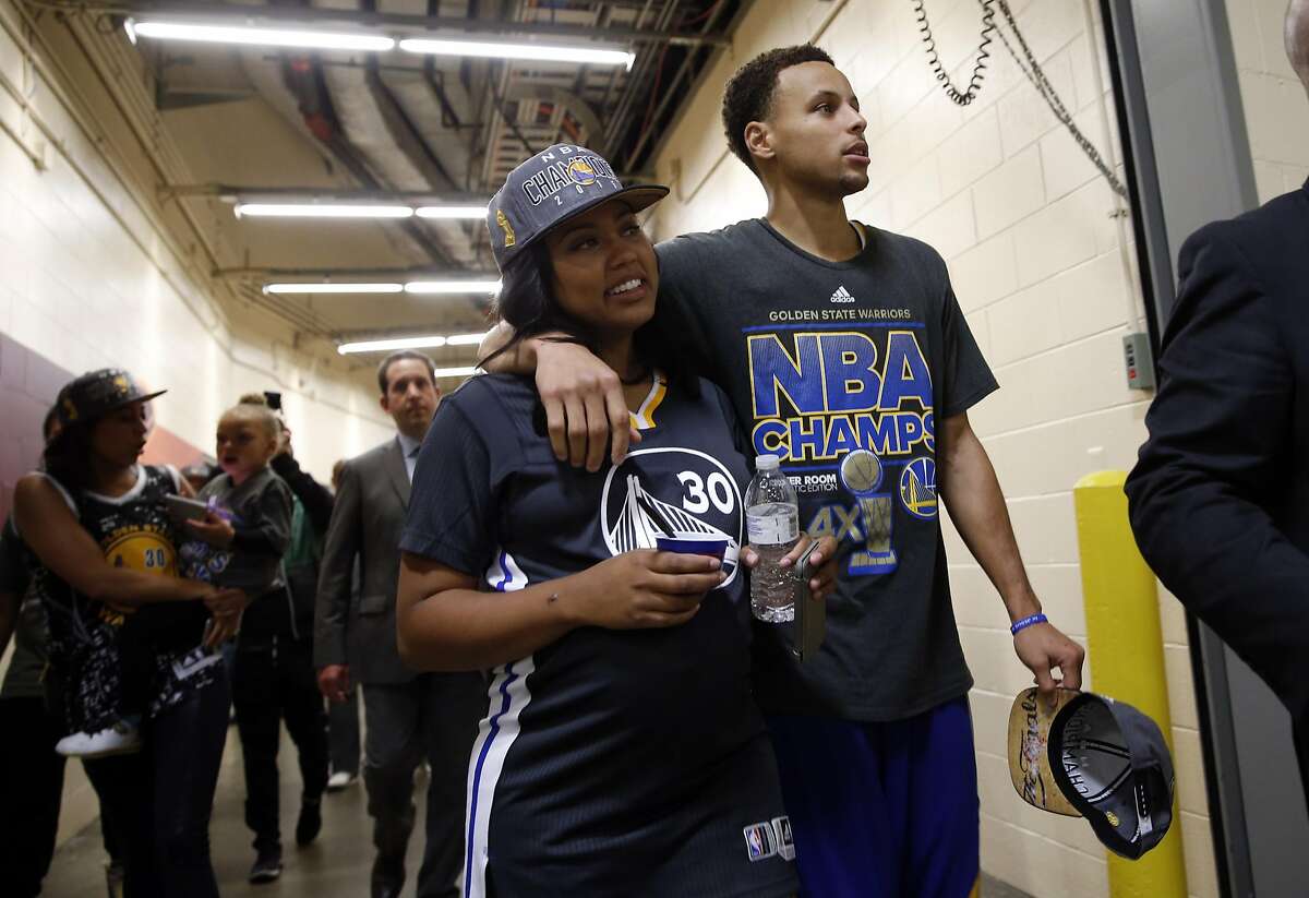 Stephen Curry walks with his wife Ayesha, then pregnant with daughter Ryan, after defeating the Cleveland Cavaliers in Game 6 of NBA Finals.