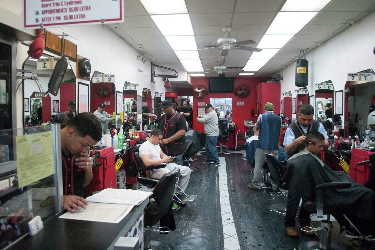 Javiel'sÂ Knockout Barber Shop is a legendary borough hangout that has predominantly served and employed Puerto Ricans. Hairstylists and patrons there have cheered on countryman Carlos Correa against the Yankees this week. ( Hunter Atkins for the Houston Chronicle )