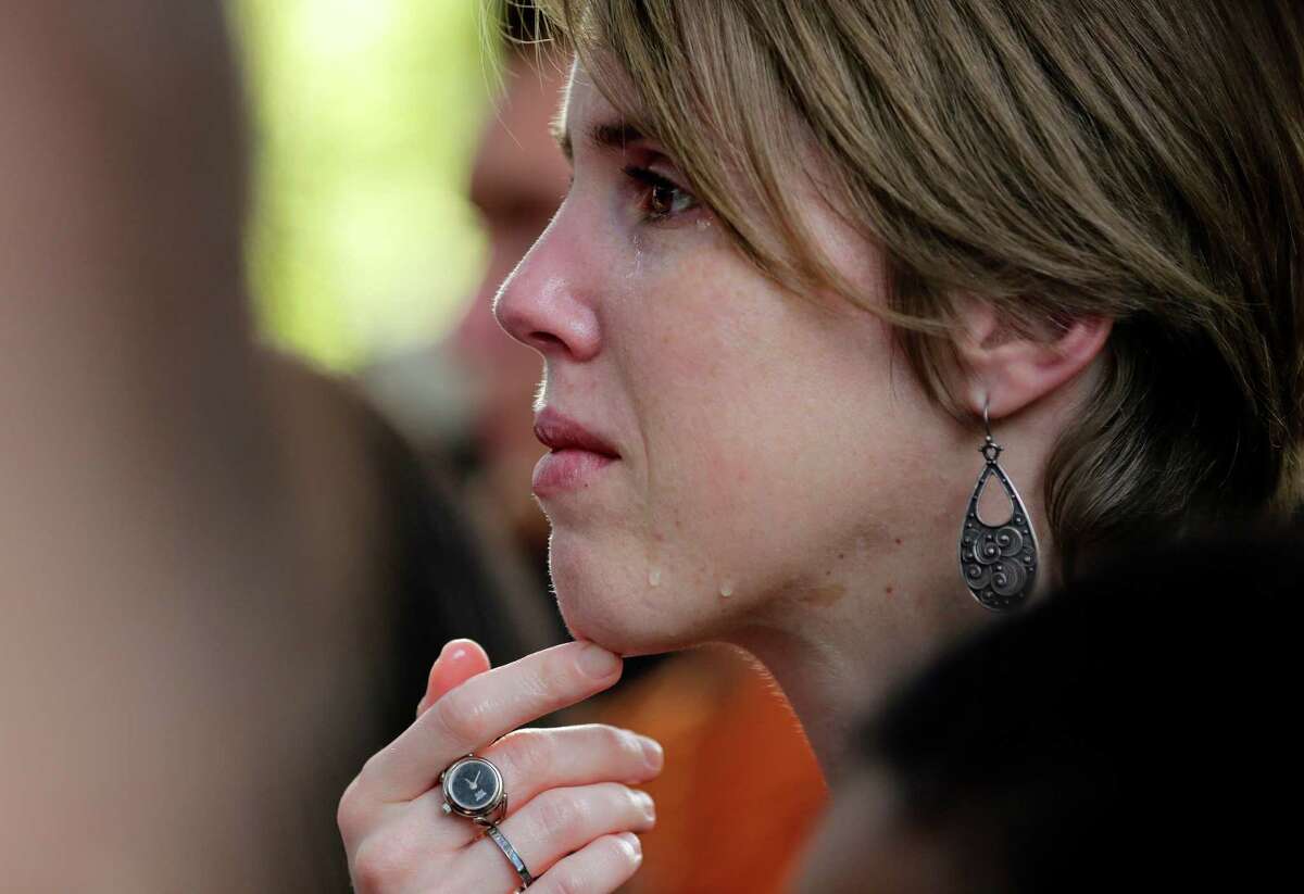A University of Texas students cries during a gathering for fellow student Haruka Weiser on campus Thursday, April 7, 2016, in Austin, Texas. Weiser, a first-year theater and dance student from Oregon, was found dead on campus after she was reporter missing earlier this week. (AP Photo/Eric Gay)