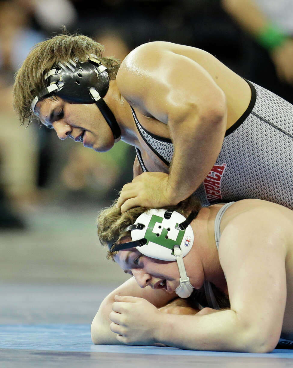 North Carolina State's Nick Gwiazdowski, top, controls Eastern Michigan's Gage Hutchison in a 285-pound match during the NCAA Division 1 wrestling championship in New York, Thursday, March 17, 2016. (AP Photo/Seth Wenig) ORG XMIT: NYSW106
