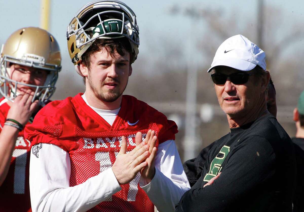 Baylor quarterback Seth Russell looks on with head coach Art Briles during the first day of spring drills on Feb. 25, 2016, in Waco.