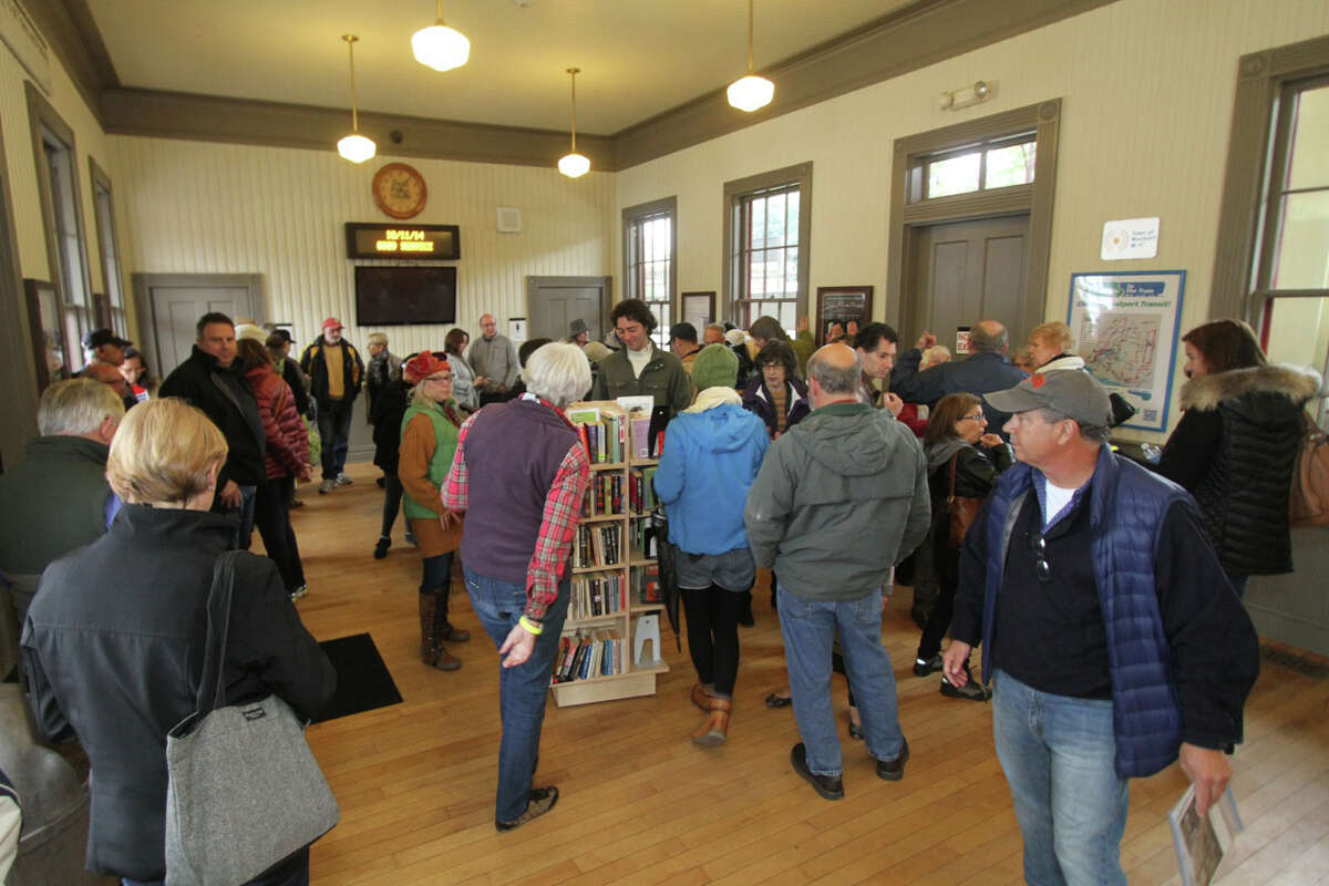 Walking tours of Saugatuck are sponsored by the Westport Historical Society. Above, participants gather for a tour at the Saugatuck Train Station.