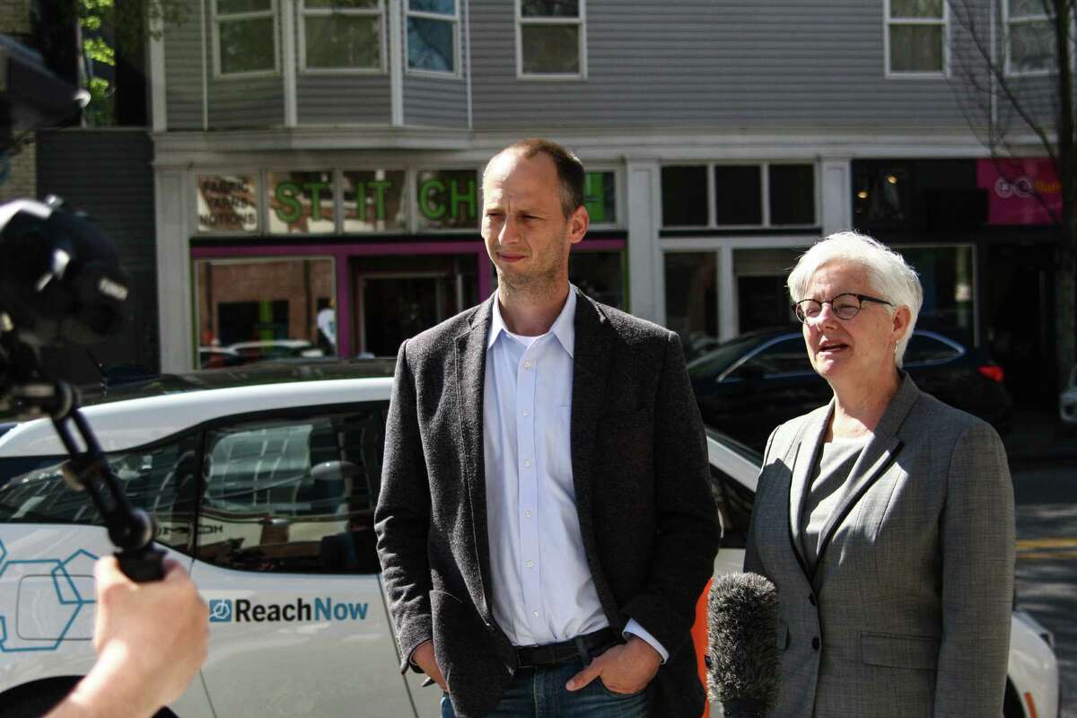 Seattle Department of Transportation Director Scott Kubly and Deputy Mayor Kate Joncas discuss the launch of BMW's ReachNow car-sharing service in Seattle after a press event Friday, April 8, 2016.