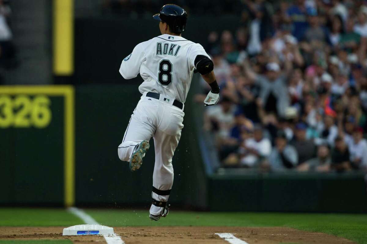 Mariners outfielder Nori Aoki cruises through first base in the first inning of the 2016 home opener against the Oakland Athletics at Safeco Field on Friday, April 8, 2016.