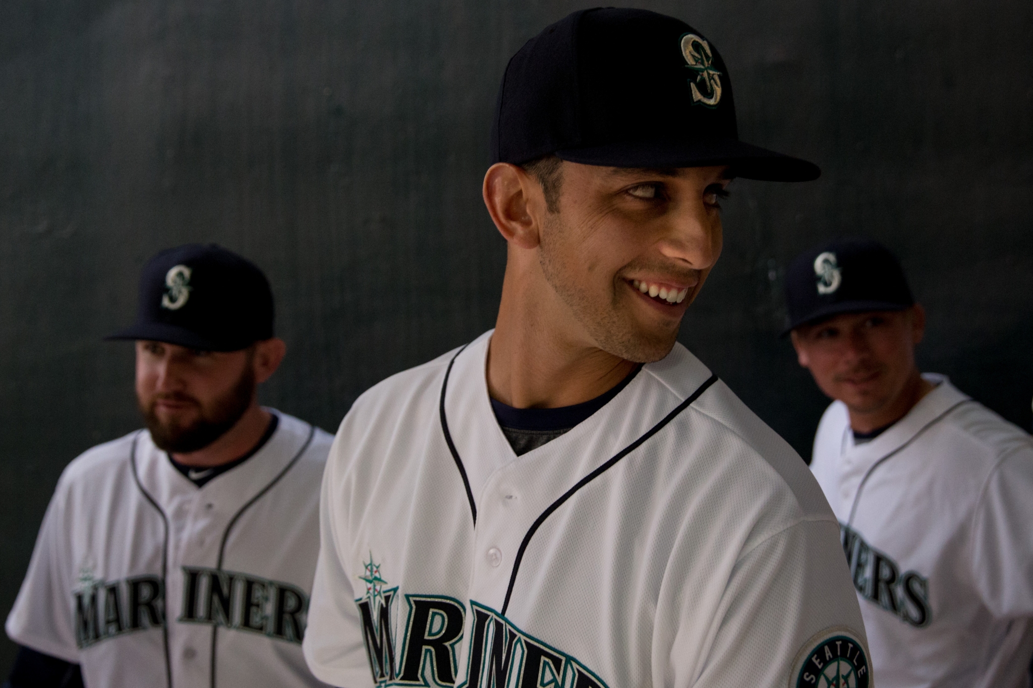 Former Seattle Mariners pitcher Felix Hernandez, front right, talks with  manager Scott Servais, left, after being inducted into the Mariners Hall of  Fame before a baseball game between the Mariners and the