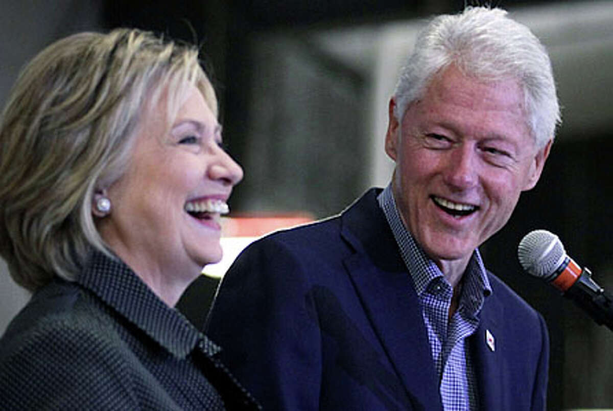 Hillary and Bill Clinton, shown here at a political event in Iowa last November, both have long records of raising money for their campaigns in Westport.
