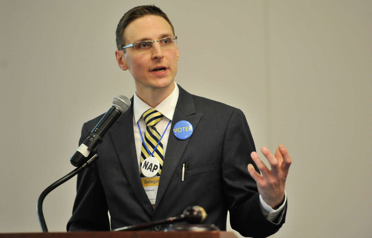 Libertarian Party Convention Chair Curt Hildebrand speaks during the convention's open day at the Norris Conference Center.