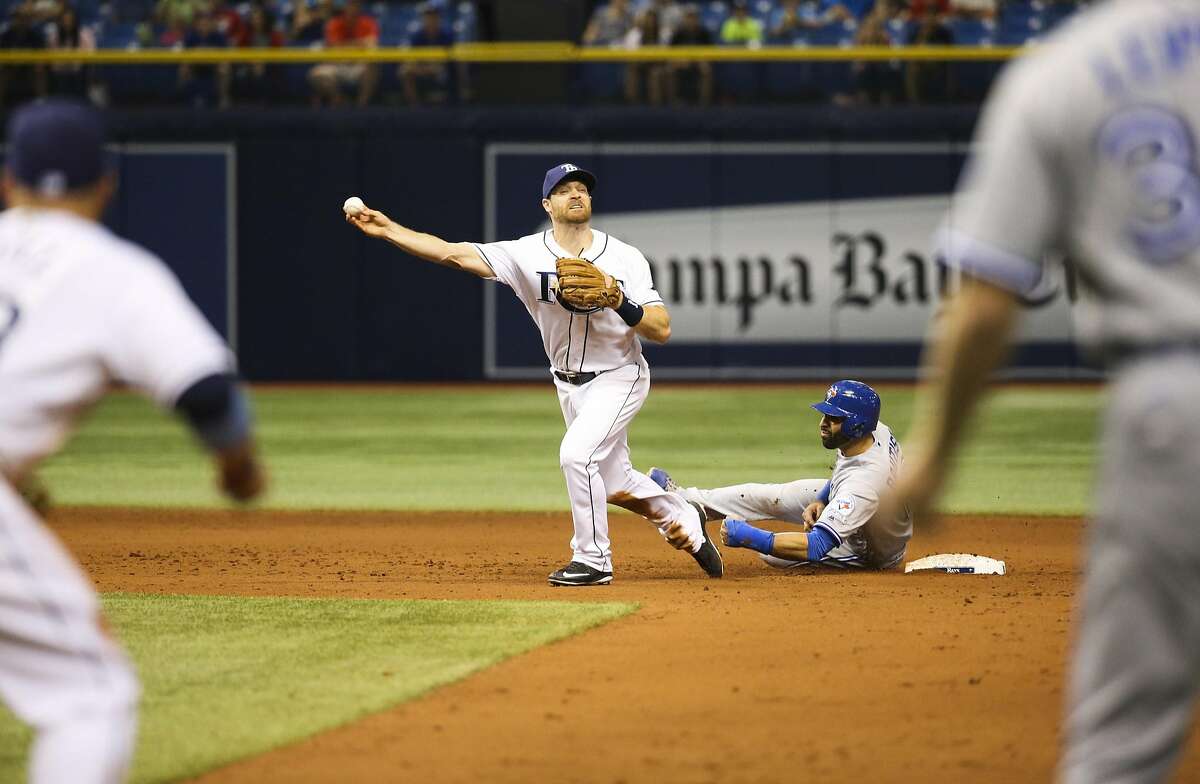 Toronto Blue Jays' Jose Bautista (19) interferes with Tampa Bay Rays second baseman Logan Forsythe as he looks to turn a double play on a ball hit by Edwin Encarnacion, that ended the baseball game after review, in St. Petersburg, Fla., on Tuesday, April 5, 2016. The Rays won 3-2. (Will Vragovic/The Tampa Bay Times via AP)