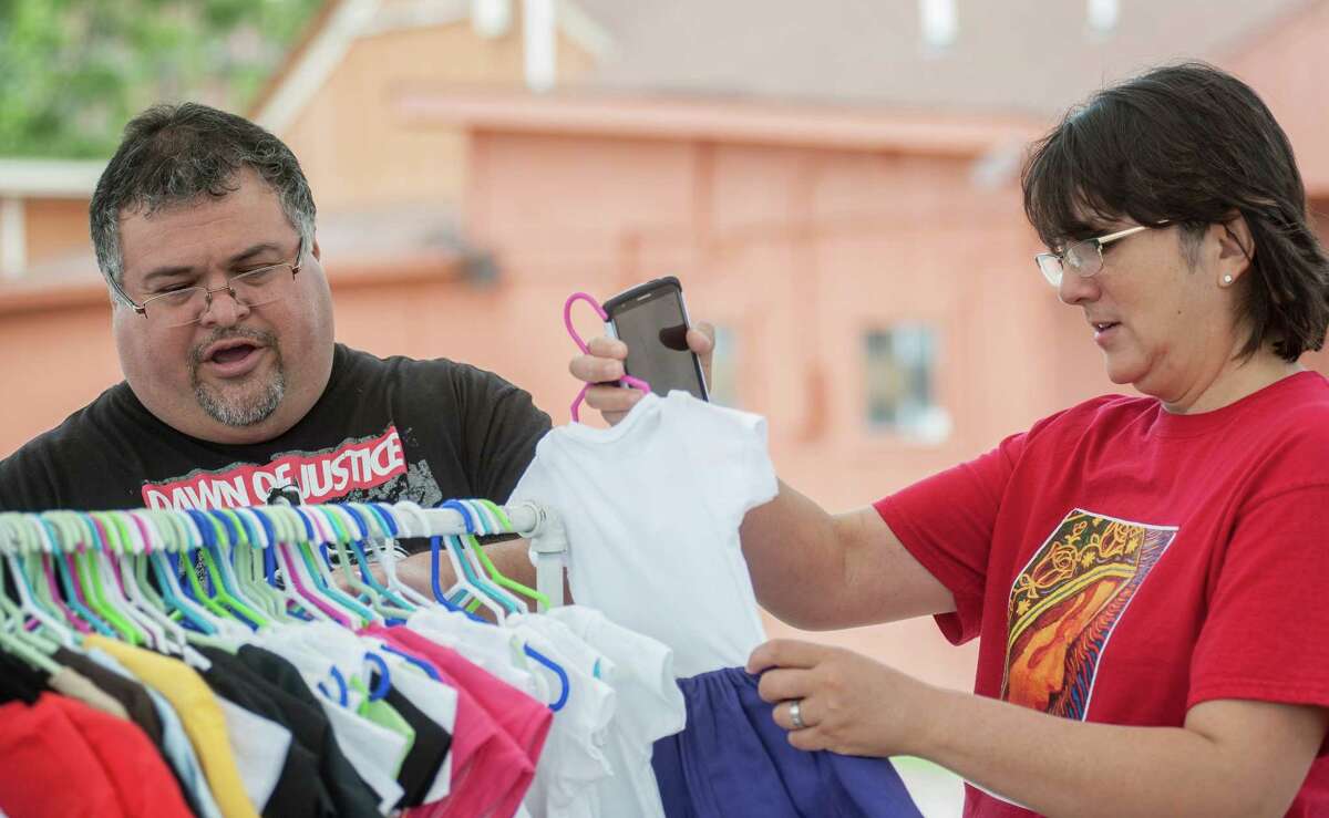 Xavier and Irma Garza look at merchandise during WestFest on Saturday, April 19th, 2016 in San Antonio. Carlos Javier Sanchez/For The Express News