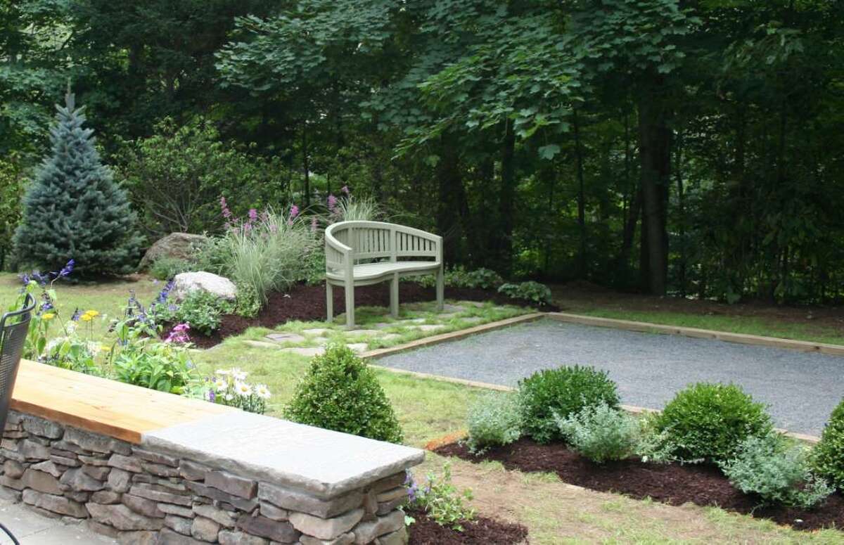 Danbury landscape designer Beth Whitty shows a client a master design plan and then breaks it up into manageable endeavors. “It’s overwhelming to look at your yard as one big project. It could be a five-year plan.”