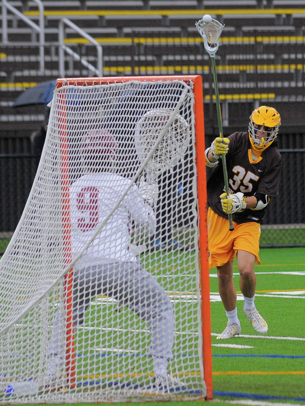 Brunswick’s Max Metalios fires a shot in for a first-half goal past Loomis Chaffee goalie Frederick Dreyer on Saturday in Greenwich. Brunswick defeated Loomis Chaffee 19-4.