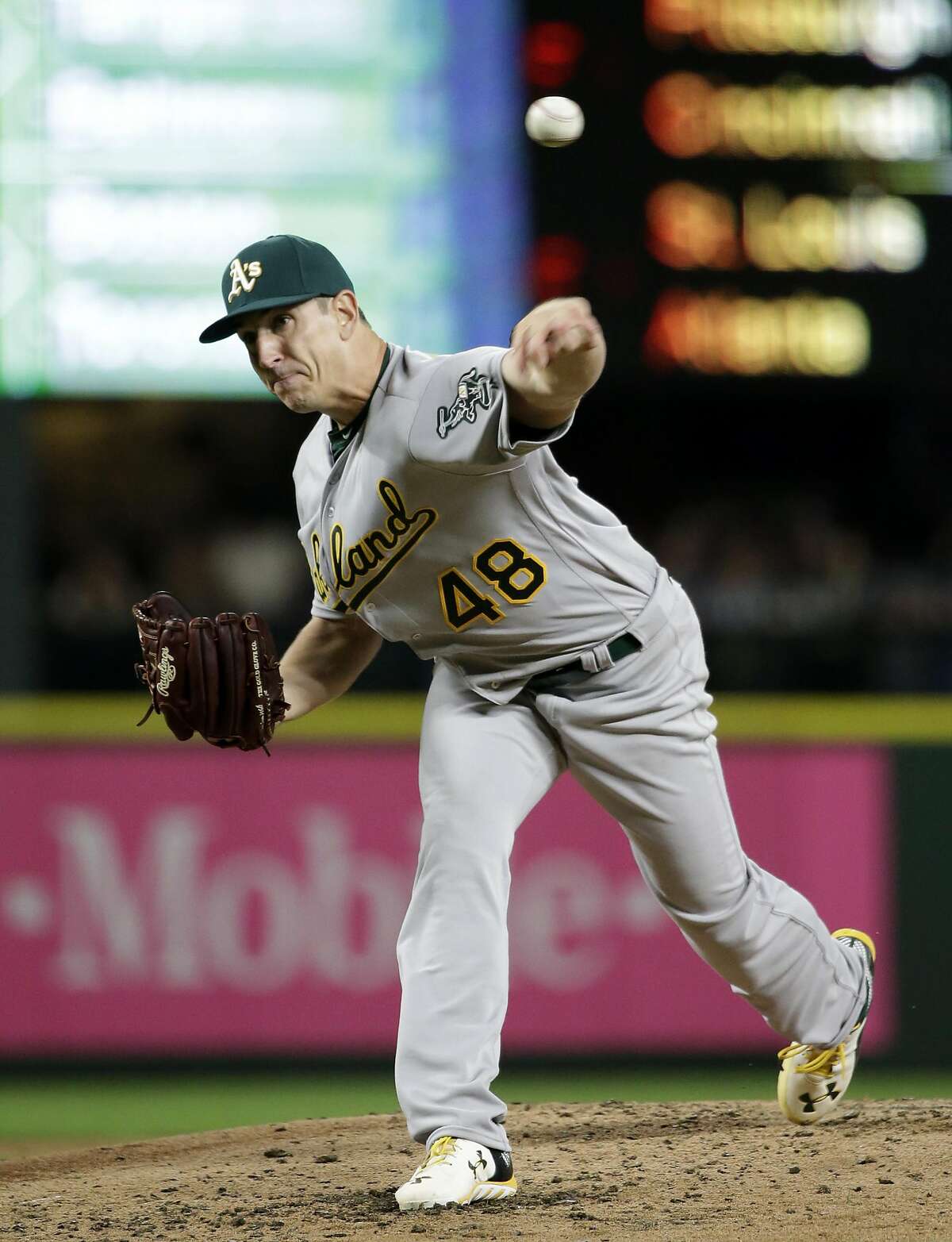 Oakland Athletics starting pitcher Eric Surkamp in action against the Seattle Mariners in the first inning in a baseball game Friday, April 8, 2016, in Seattle. (AP Photo/Elaine Thompson)