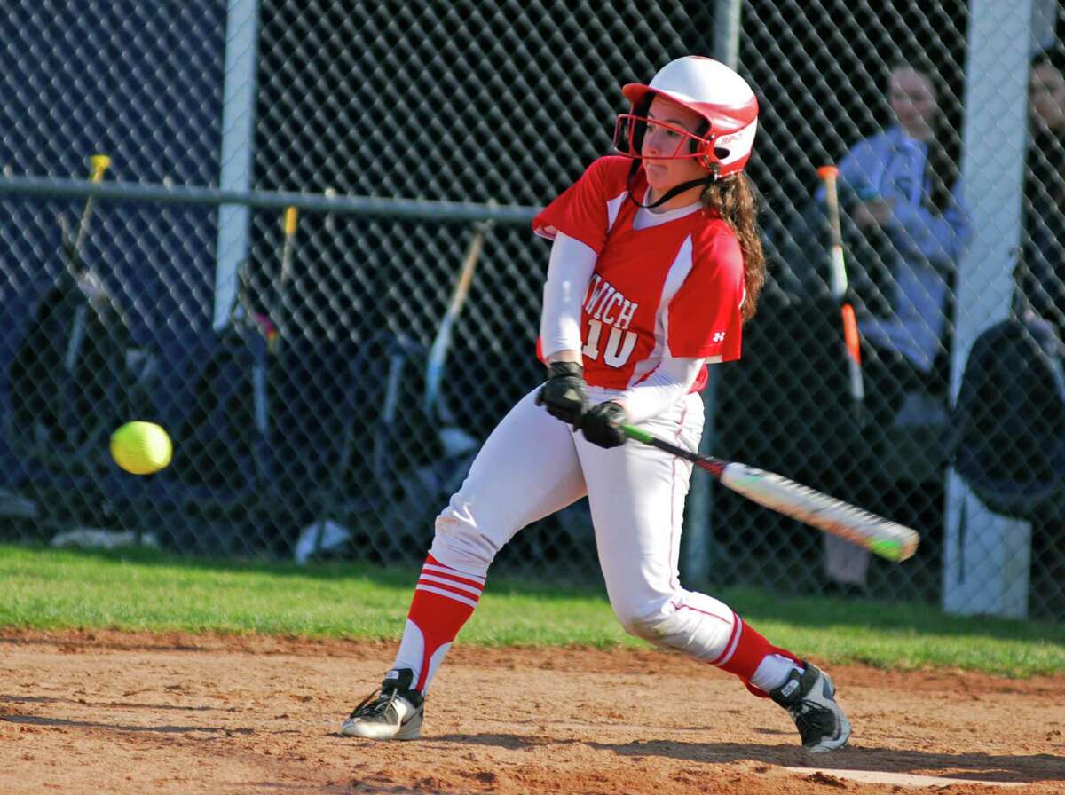 Greenwich’s Julie Gambino swings for a pitch during a softball game against Staples in Westport on Sunday.
