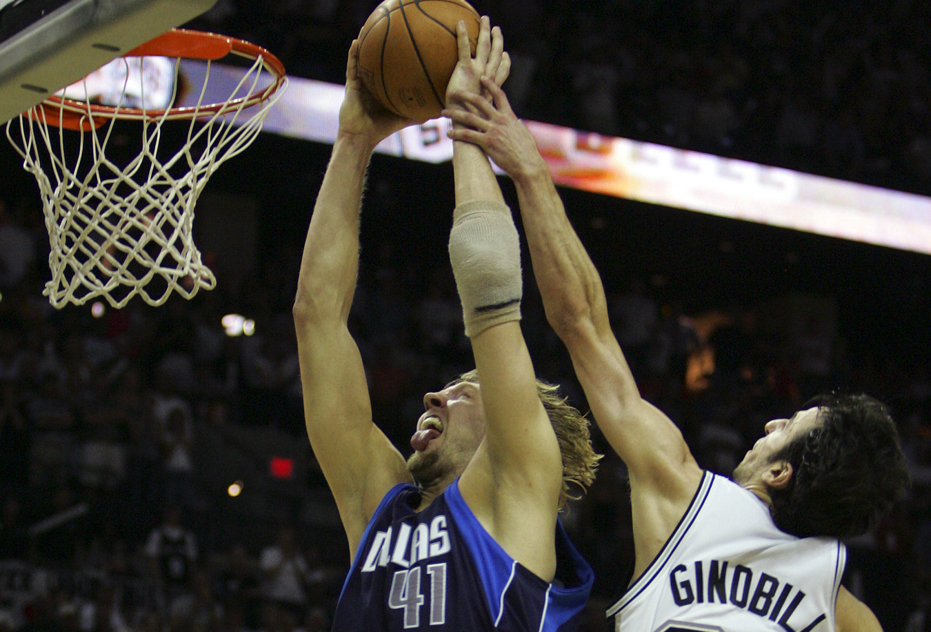 San Antonio Spurs' Michael Finley (4) dunks over Dallas Mavericks