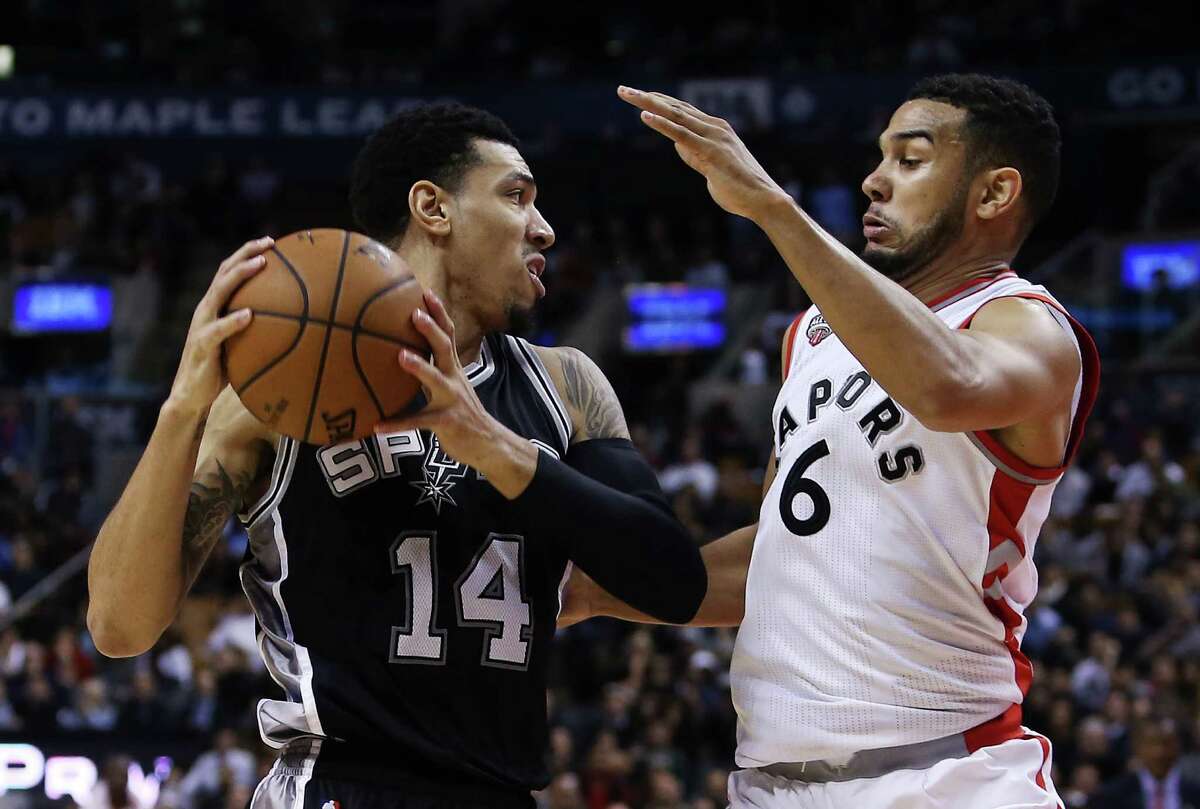 Danny Green of Spurs battles with Cory Joseph of the Raptors at the Air Canada Centre on Dec. 9, 2015 in Toronto.