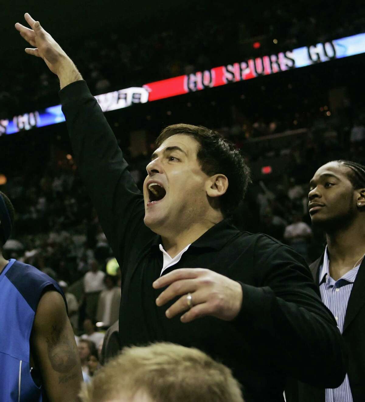 Dallas Mavericks owner Mark Cuban celebrates at the end of Game 7 against the San Antonio Spurs in the Western Conference semifinals during the 2006 NBA playoffs in San Antonio on May 22, 2006.