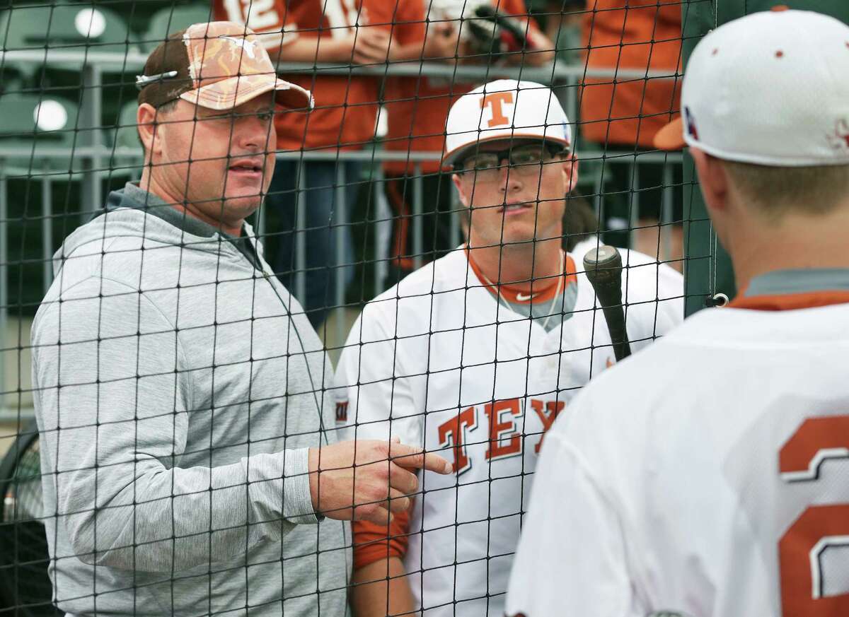 Roger Clemens talks with his sons Kacy (center) and Kody after the game as Texas loses to TCU 9-5 in college baseball at Disch-Falk Field in Austin on March 26, 2016.