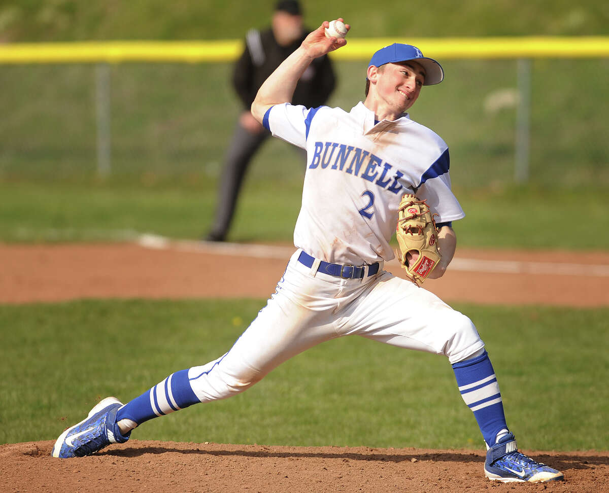 Bunnell pitcher Adam Wojenski delivers to the plate during the 3rd inning of the Bulldogs' home baseball game with Masuk at Bunnell High School in Stratford, Conn. on Monday, April 11, 2016.