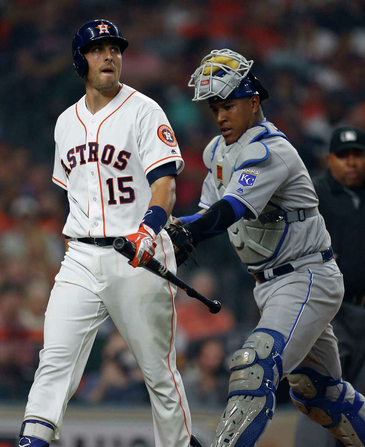 Houston Astros catcher Jason Castro (15) is tagged by Kansas City Royals catcher Salvador Perez (13) after he struck out during the second inning of an MLB game at Minute Maid Park, Monday, April 11, 2016, in Houston.
