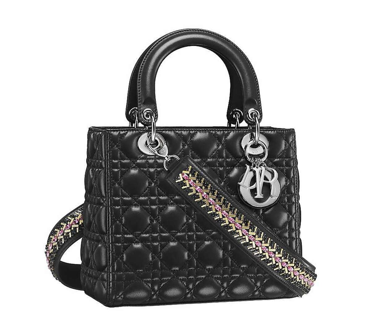 The calfskin Lady Dior�handbag ($4,900) reflects motifs from �the fashion house's history: good luck charms, and the cannage (cane-weaving technique) in the crystal embroidered strap.