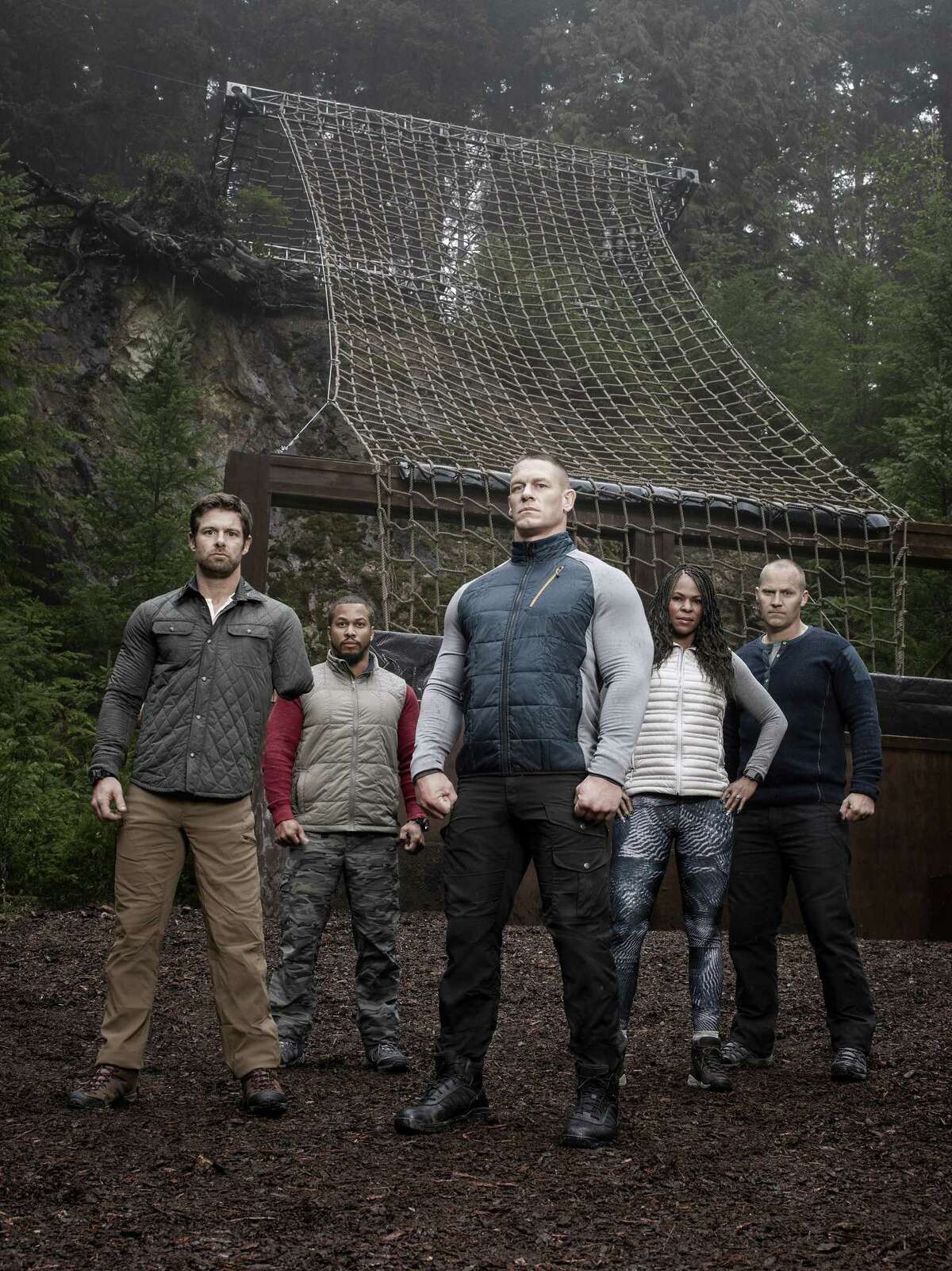 Host John Cena is flanked by military mentors Noah Galloway, Nick ?“The Reaper?” Irving, Tawanda ?“Tee?” Hanible and Rorke Denver on Fox's new TV reality series 'American Grit.'.
